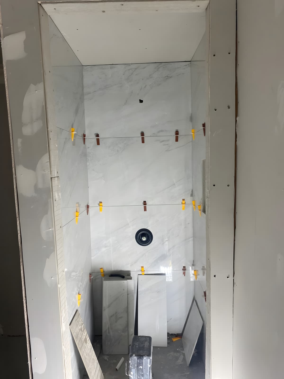 Bathroom stripped to the studs with plumbing rough-in